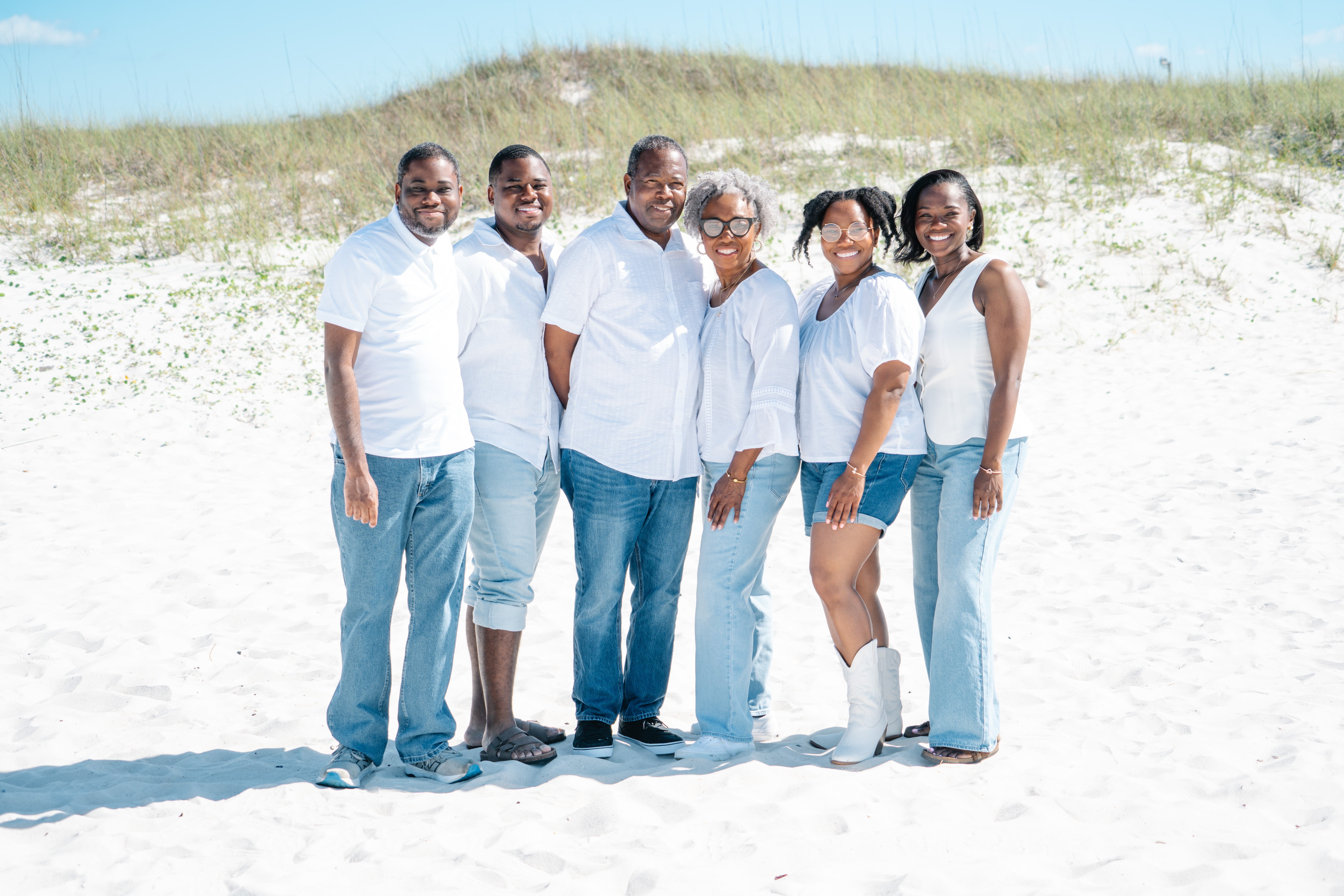 a family posing for a photo in a beautiful setting