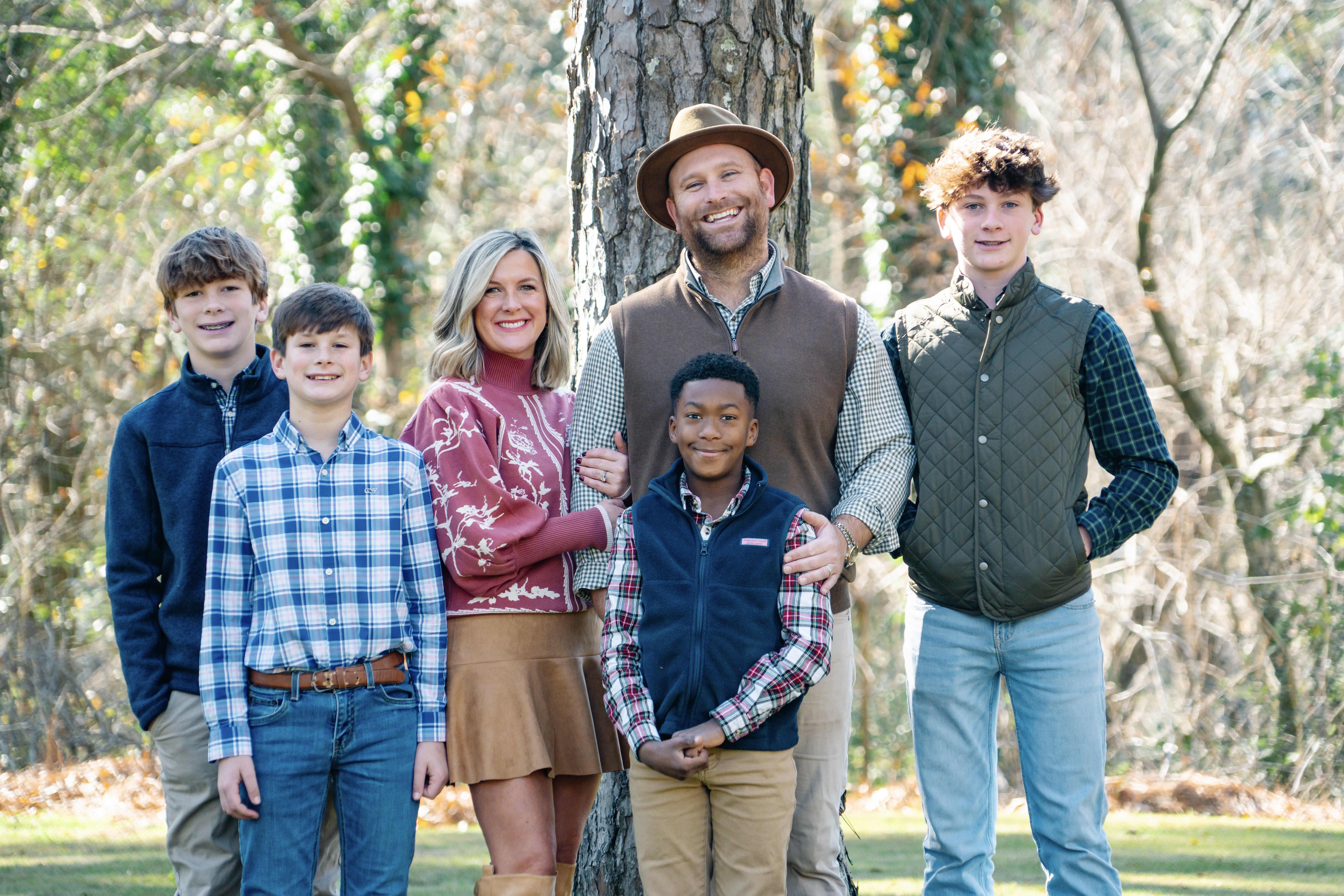 a family standing together in a beautiful setting