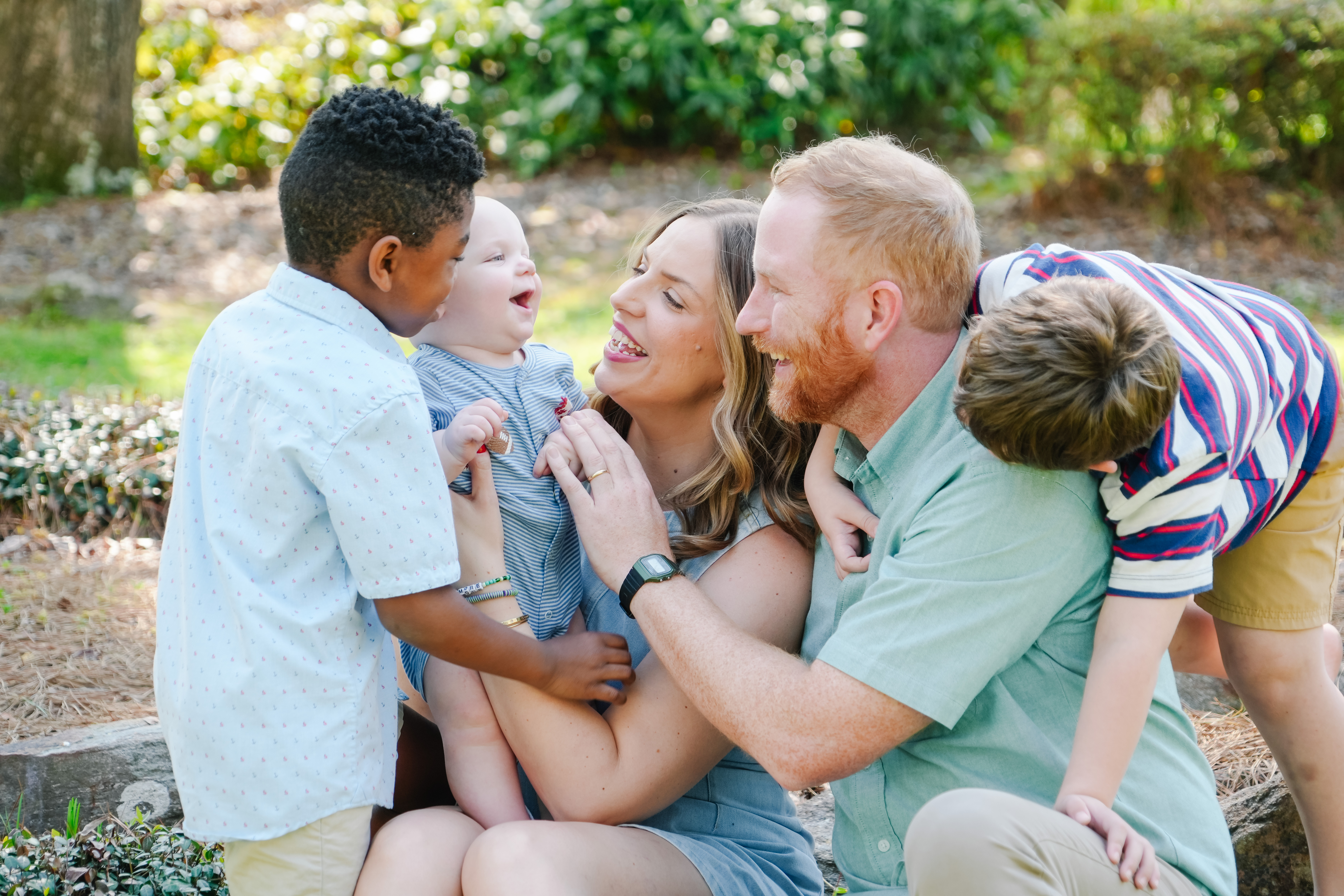 a family standing together in a beautiful setting