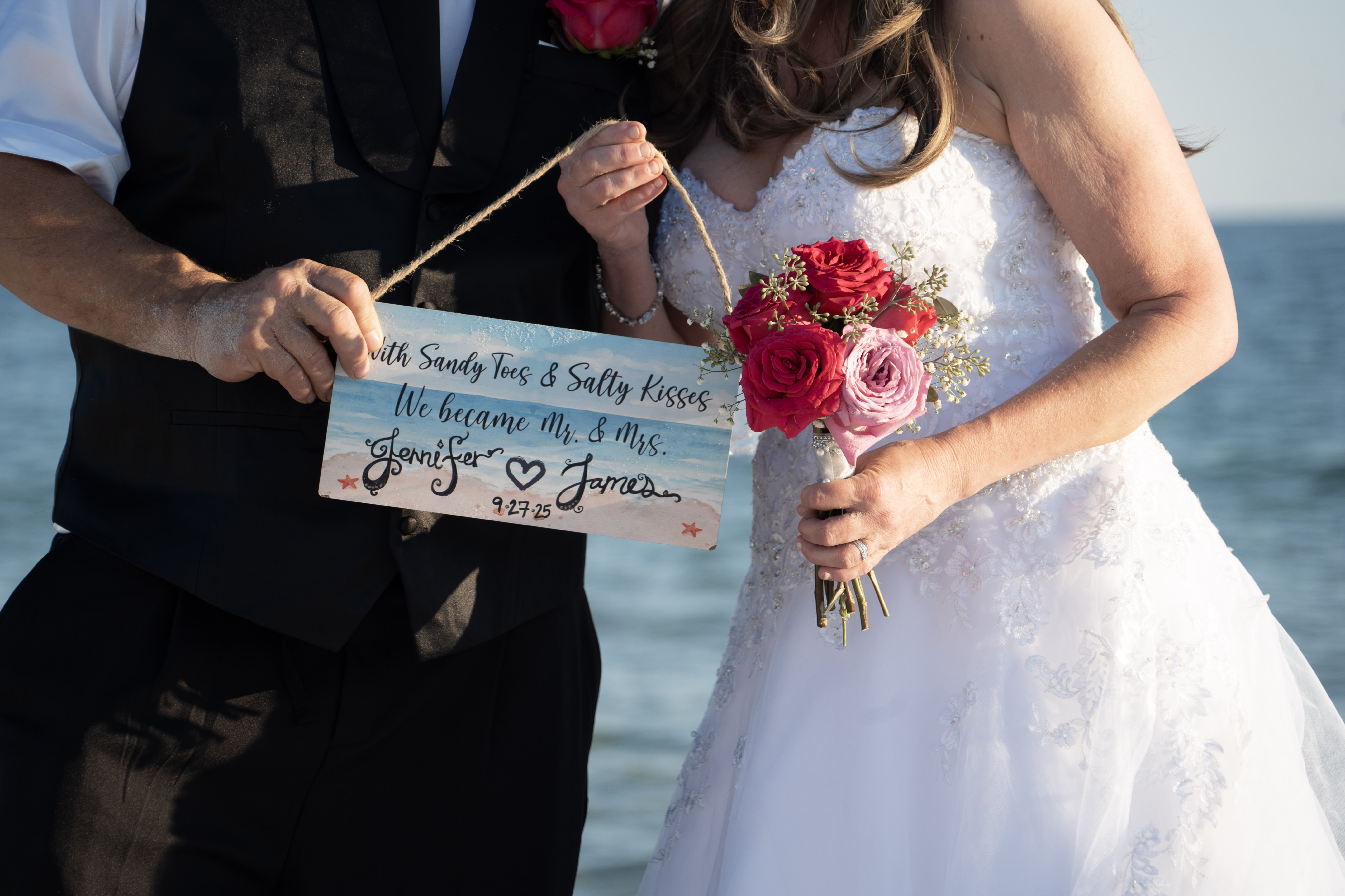 bride standing with a boquet of flowers